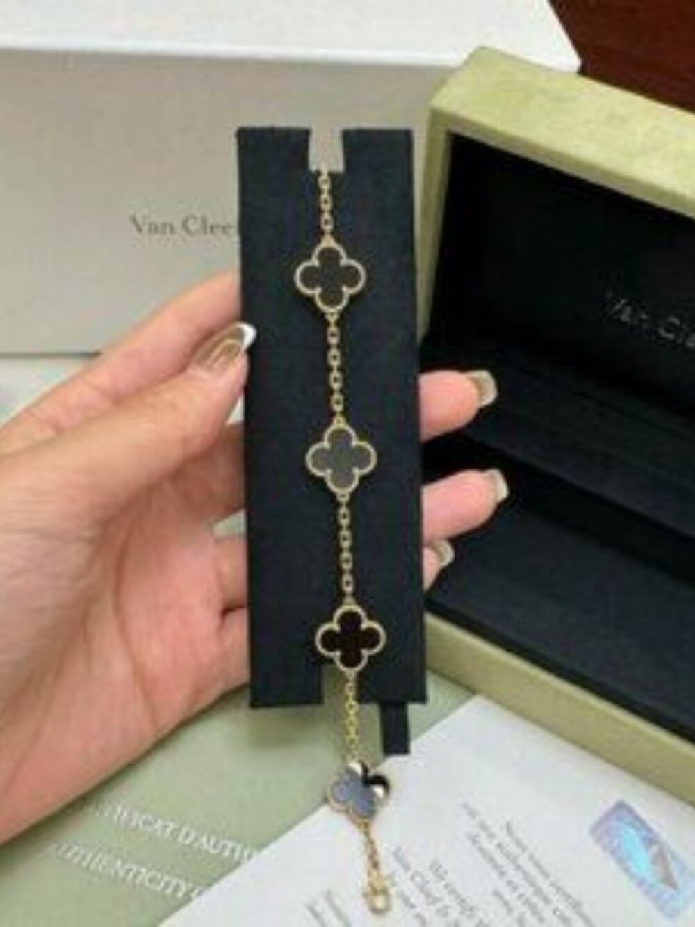 Van Cleef & Arpels 18K gold onyx 5-flower bracelet